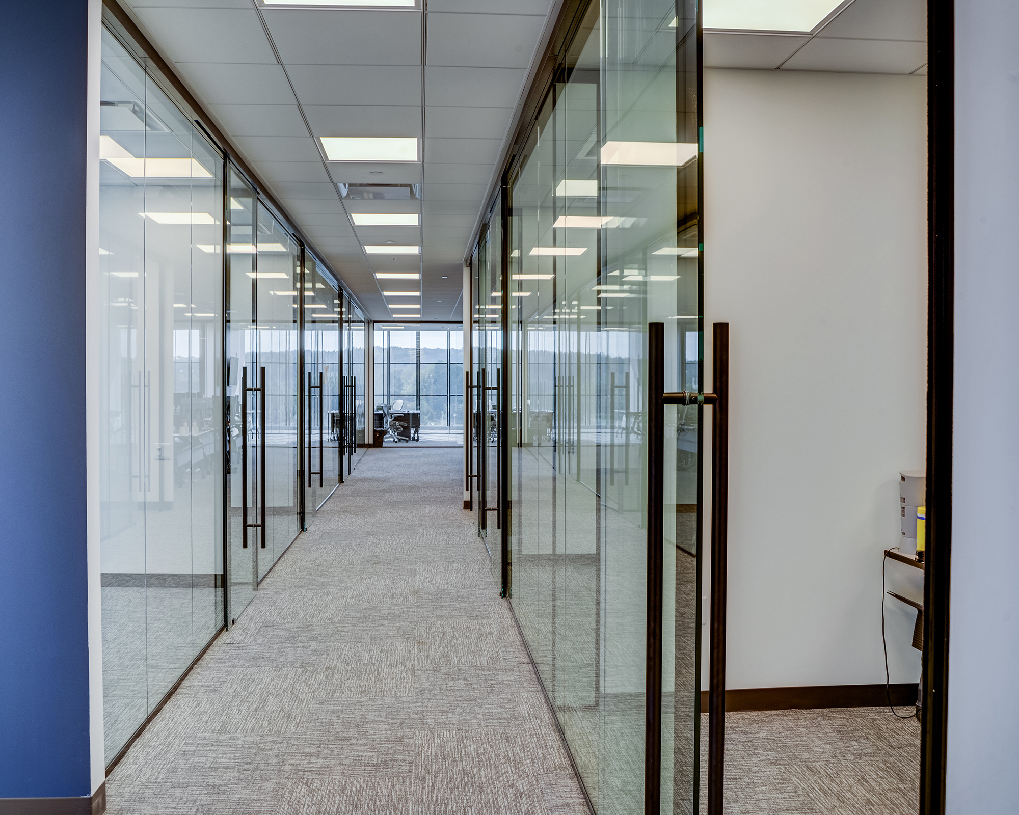 Office Hallways with bright glass cubicles