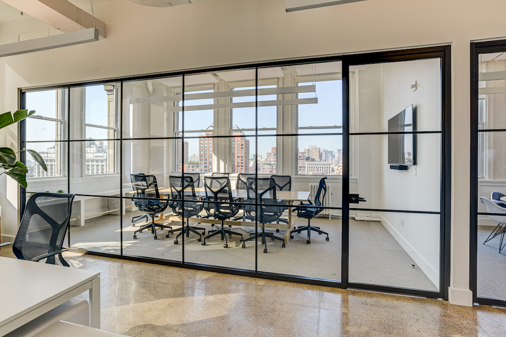 Bright, Framed Glass Partitioned Office with city view