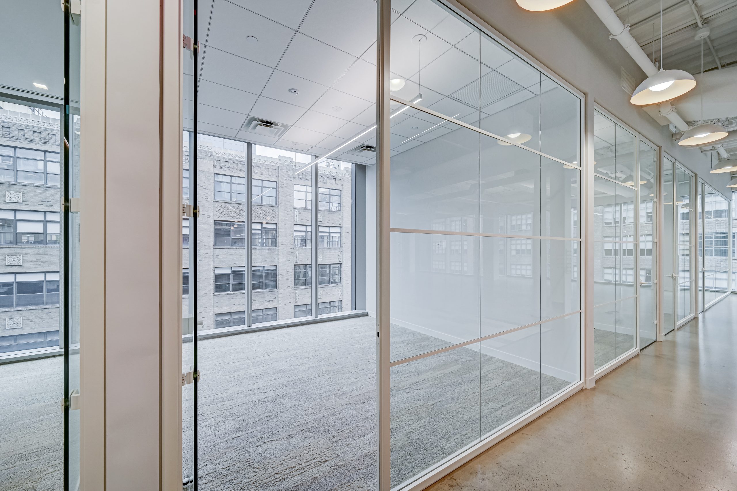 Clear office glass partitions with white frame