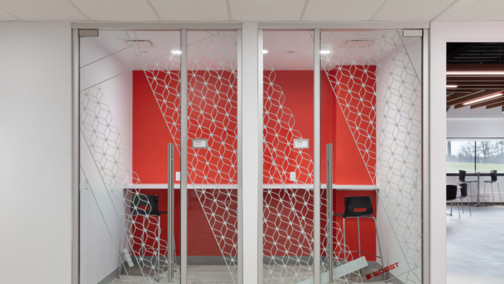 Geometric pattern distraction marker in phone booths with glass interiors.