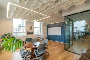 glass-interiors-with-wood-ceiling-system-open-meeting-room